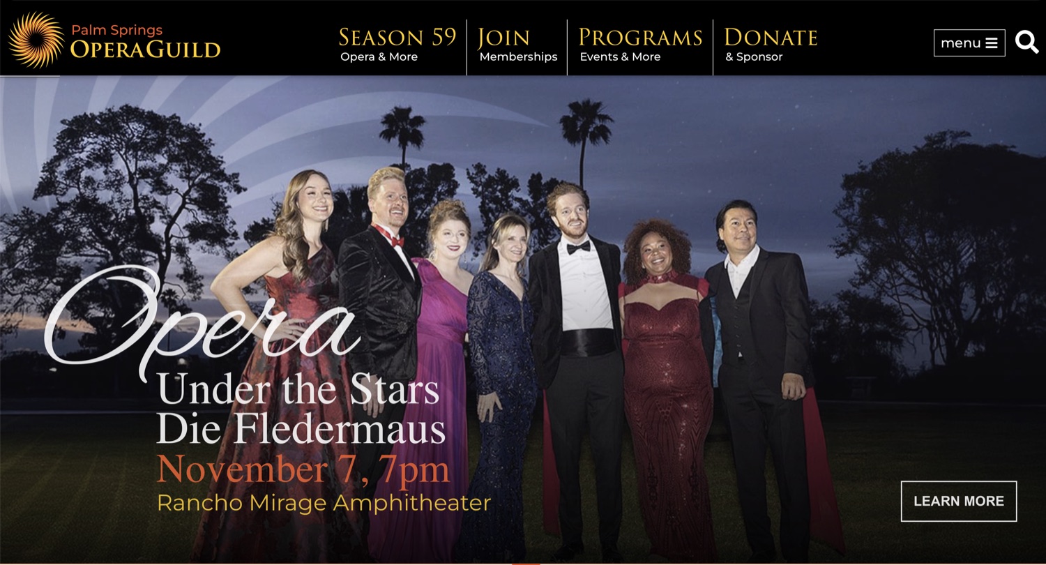 The Palm Springs Opera Guild homepage, with the new sun mark and an Opera Under the Stars hero: the Die Fledermaus cast photographed at dusk.